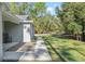 A beautiful front yard with a well-manicured lawn and a concrete walkway at 18301 Sw 69Th Loop, Dunnellon, FL 34432