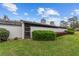 Fenced backyard features manicured landscaping and a private entrance to the home at 1947 Se 37Th Court Cir, Ocala, FL 34471