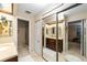 Bathroom featuring dual sinks, a shower, tile flooring, and large mirrors to create an open space at 1947 Se 37Th Court Cir, Ocala, FL 34471