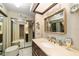 Bathroom featuring a vanity with drawers, tiled floors, and an oversized mirror creating a bright space at 1947 Se 37Th Court Cir, Ocala, FL 34471