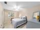 Bright bedroom featuring neutral colors, a ceiling fan, and a comfortable bed at 1947 Se 37Th Court Cir, Ocala, FL 34471