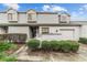 Well-maintained townhouse exterior with tidy landscaping, painted brick accents, and private entrance at 1947 Se 37Th Court Cir, Ocala, FL 34471