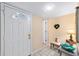 Bright foyer with tiled floors, decorated table, and a view of the front door with a decorative window at 1947 Se 37Th Court Cir, Ocala, FL 34471