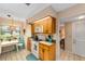 Bright, compact kitchen featuring white appliances and tile flooring, with an adjacent breakfast nook at 1947 Se 37Th Court Cir, Ocala, FL 34471