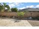 Backyard featuring landscaping and decorative rocks surrounded by a stone fence at 1986 Altamonte Way, The Villages, FL 32162