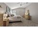 Relaxing bedroom featuring herringbone floors, ceiling fan, and wicker decor at 1986 Altamonte Way, The Villages, FL 32162