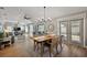 Light-filled dining room with stylish furniture, flowing into a comfortable living space and outdoor patio at 1986 Altamonte Way, The Villages, FL 32162