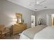 Inviting main bedroom featuring wood floors, neutral paint, and natural light at 1986 Altamonte Way, The Villages, FL 32162