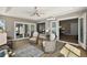 Relaxing sun room with ceiling fan, neutral colors, and sliding glass doors to the outside at 1986 Altamonte Way, The Villages, FL 32162