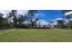 Fenced backyard offering ample space for outdoor activities at 3326 Sw 128Th Street Rd, Ocala, FL 34473