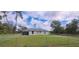 View of the home's fully fenced backyard with a well-maintained lawn and a shed at 3326 Sw 128Th Street Rd, Ocala, FL 34473