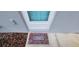 Inviting front entrance with a colorful welcome mat, showcasing curb appeal at 3326 Sw 128Th Street Rd, Ocala, FL 34473