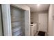 Well-equipped laundry room with shelving, storage, and washer/dryer hookups at 3326 Sw 128Th Street Rd, Ocala, FL 34473