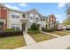 Townhomes with colorful exterior, maintained landscaping, and inviting walkways at 4491 Sw 49Th Ave, Ocala, FL 34474