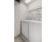 Well-lit laundry room featuring a washer and dryer, with a Laundry Room themed decal on the wall at 4491 Sw 49Th Ave, Ocala, FL 34474