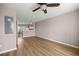 Living room with laminate wood flooring and view into the kitchen at 4491 Sw 49Th Ave, Ocala, FL 34474