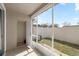 This enclosed patio provides an airy outdoor space that leads to a fenced yard with a small A/C unit at 4491 Sw 49Th Ave, Ocala, FL 34474