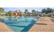 Community swimming pool with lounge chairs and umbrellas around the pool deck at 4491 Sw 49Th Ave, Ocala, FL 34474