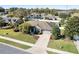 Aerial view of a home with a large yard, and inground pool and surrounded by lush greenery at 4731 Se 32Nd St, Ocala, FL 34480