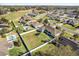 Overhead shot revealing a fenced yard, in-ground pool with tiki bar, and nearby community spaces at 4731 Se 32Nd St, Ocala, FL 34480