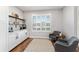 Stylish coffee bar area with open shelving, white cabinets, and plantation shutters at 4731 Se 32Nd St, Ocala, FL 34480