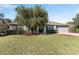 Single Gathering home with two car garage, well-manicured lawn and mature landscaping at 4731 Se 32Nd St, Ocala, FL 34480