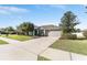 Charming single-story home features a well-manicured lawn, a two-car garage and beautiful landscaping at 4731 Se 32Nd St, Ocala, FL 34480