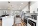 Modern kitchen featuring an island with seating, stainless steel appliances, and lots of light at 4731 Se 32Nd St, Ocala, FL 34480