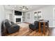 Inviting living room showcasing a fireplace, built-in shelving, plantation shutters, and wood-look flooring at 4731 Se 32Nd St, Ocala, FL 34480