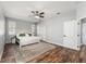 Spacious main bedroom with wood-look floors, neutral paint, and an overhead ceiling fan at 4731 Se 32Nd St, Ocala, FL 34480