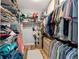 Organized walk-in closet featuring shelving, clothing racks, and a built-in drawer unit at 4731 Se 32Nd St, Ocala, FL 34480