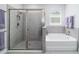 Relaxing bathroom featuring a soaking tub, separate shower, and modern fixtures for a spa-like experience at 5370 Sw 45Th Ave, Ocala, FL 34474