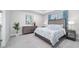 Serene bedroom with a tray ceiling, neutral tones, and stylish furnishings for a relaxing retreat at 5370 Sw 45Th Ave, Ocala, FL 34474