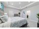 This bedroom offers ample space, soft lighting, and modern decor for a tranquil atmosphere at 5370 Sw 45Th Ave, Ocala, FL 34474