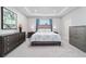 This spacious bedroom features a tray ceiling, soft lighting, and stylish furnishings for a relaxing retreat at 5370 Sw 45Th Ave, Ocala, FL 34474