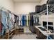 Spacious walk-in closet with ample shelving and clothing racks, plus a desk for added functionality at 5370 Sw 45Th Ave, Ocala, FL 34474