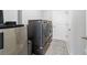 Laundry room includes appliances, a utility sink, and ample storage, perfect for streamlining chores at 5370 Sw 45Th Ave, Ocala, FL 34474