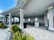 Outdoor lounge area with comfortable seating, ceiling fans, and a bar area at 5370 Sw 45Th Ave, Ocala, FL 34474