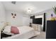 Bedroom featuring a queen bed, white dresser, and decor at 6213 Sw 97Th St, Ocala, FL 34476