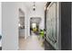 Inviting foyer featuring tile floors, arched doorways, and views into the kitchen and living room at 6213 Sw 97Th St, Ocala, FL 34476