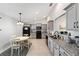 Well-lit kitchen and breakfast nook with modern appliances and gray cabinets at 6213 Sw 97Th St, Ocala, FL 34476