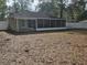 Large backyard with a screen room addition to the home at 6699 Nw 61St St, Ocala, FL 34482