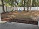 Large, private backyard featuring mature trees and a white fence at 6699 Nw 61St St, Ocala, FL 34482