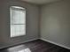 Bedroom with wood-look floors and natural light at 6699 Nw 61St St, Ocala, FL 34482