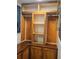 Walk-in closet showing wooden cabinetry and shelves at 6699 Nw 61St St, Ocala, FL 34482