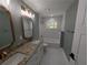 Stylish bathroom with granite countertop, double sinks, modern light fixtures, and white tiling at 8303 Sw 127 Ave, Dunnellon, FL 34432