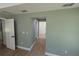 Spacious bedroom with a walk-in closet and natural light, complemented by modern flooring at 8303 Sw 127 Ave, Dunnellon, FL 34432
