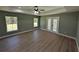 Spacious bedroom with tray ceiling, wood floors, and lots of natural light at 8303 Sw 127 Ave, Dunnellon, FL 34432