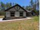 Charming home with stone accents and a landscaped walkway leading to the front door at 8303 Sw 127 Ave, Dunnellon, FL 34432