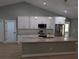 Open kitchen with granite countertops, stainless steel appliances, and a spacious island at 8303 Sw 127 Ave, Dunnellon, FL 34432